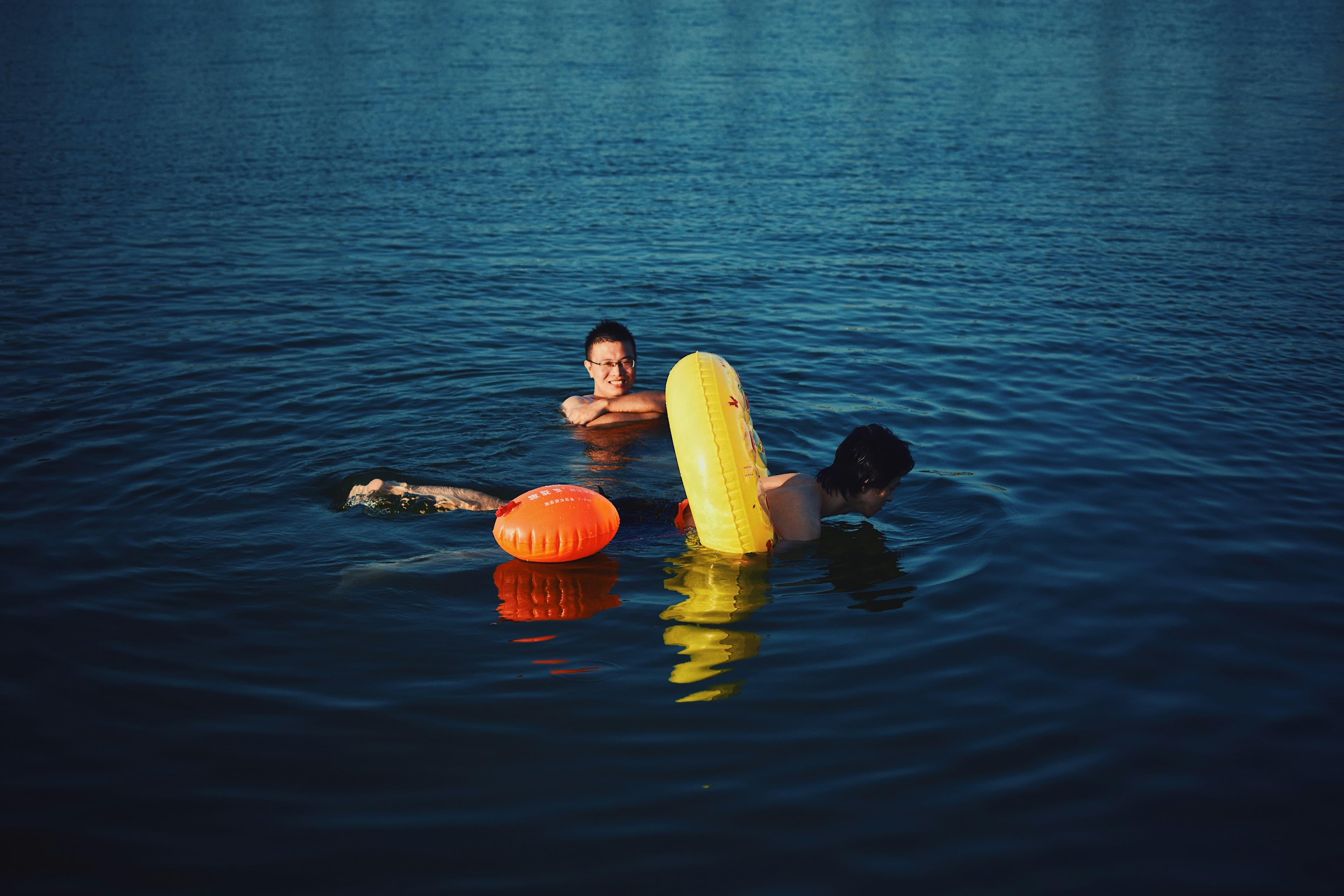 Camp counselors in life jackets by the water