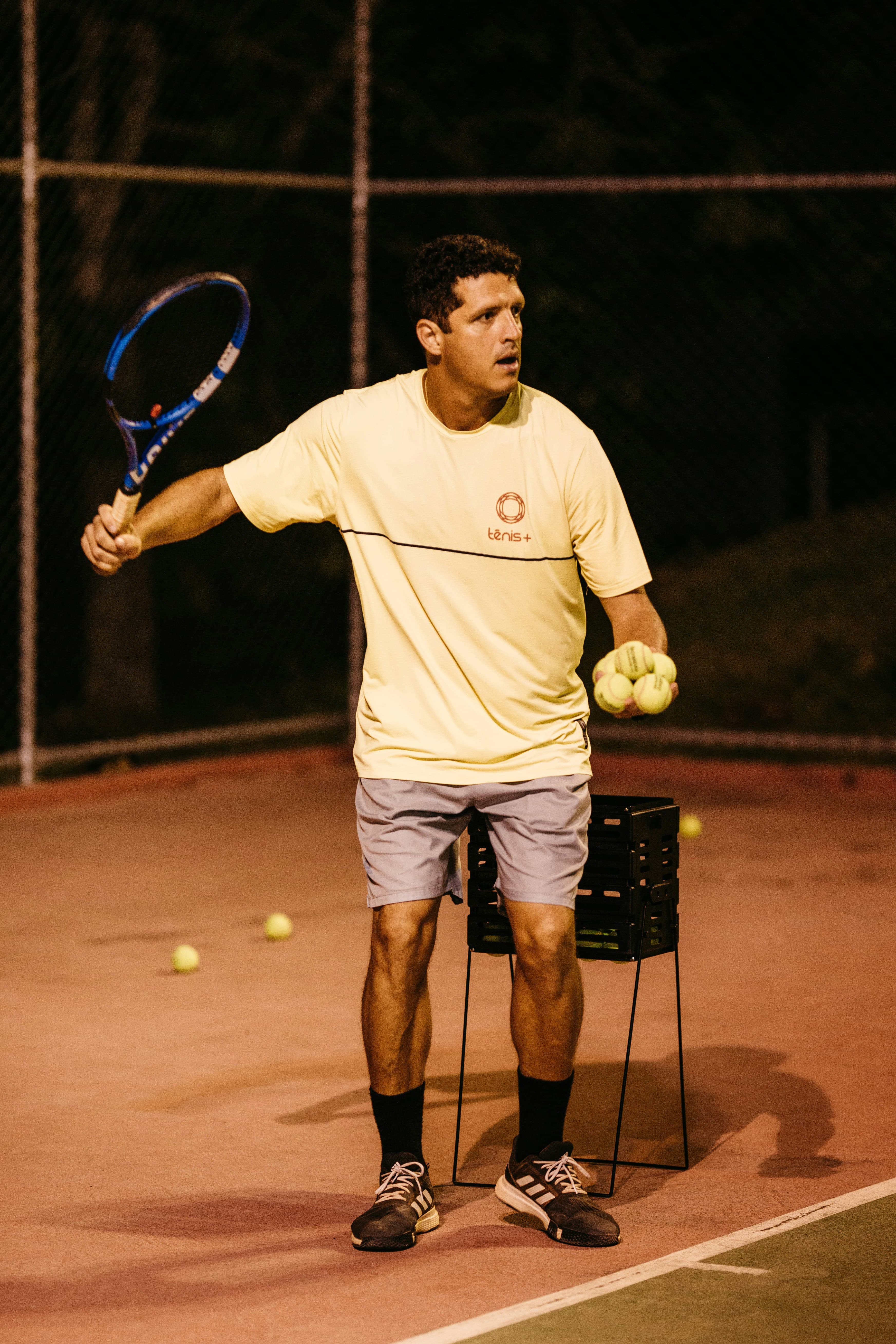 Person playing tennis at camp