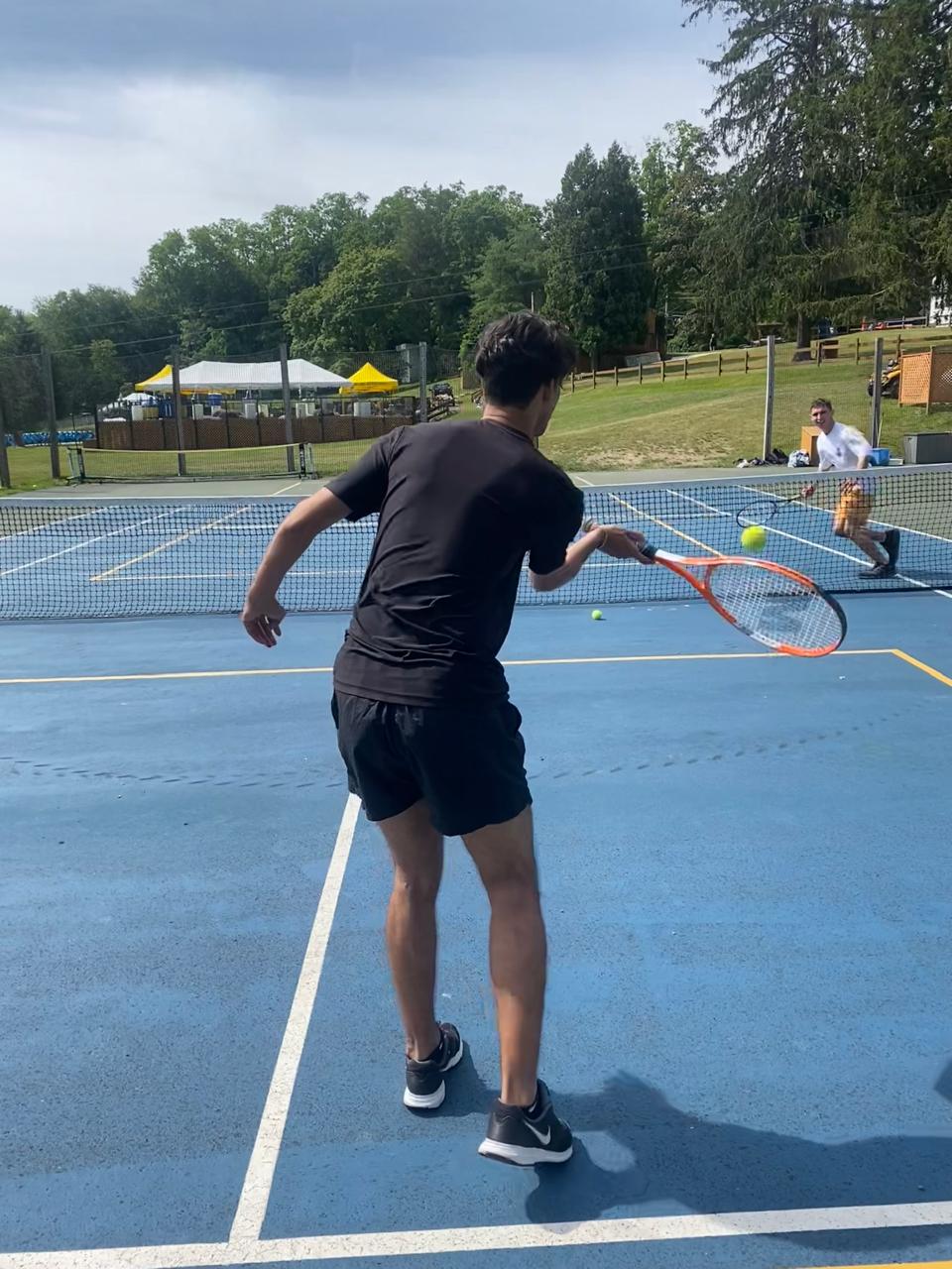 Tennis lesson on the camp courts